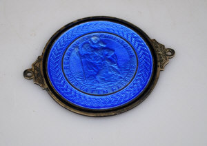 Appraisal: A silver and blue basse-taille enamel circular St Christopher medallion