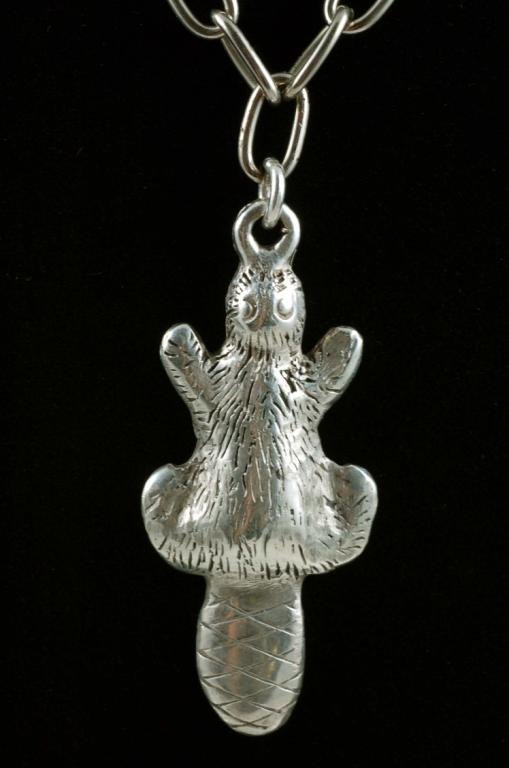 Appraisal: A trade silver pendant in the form of a beaver