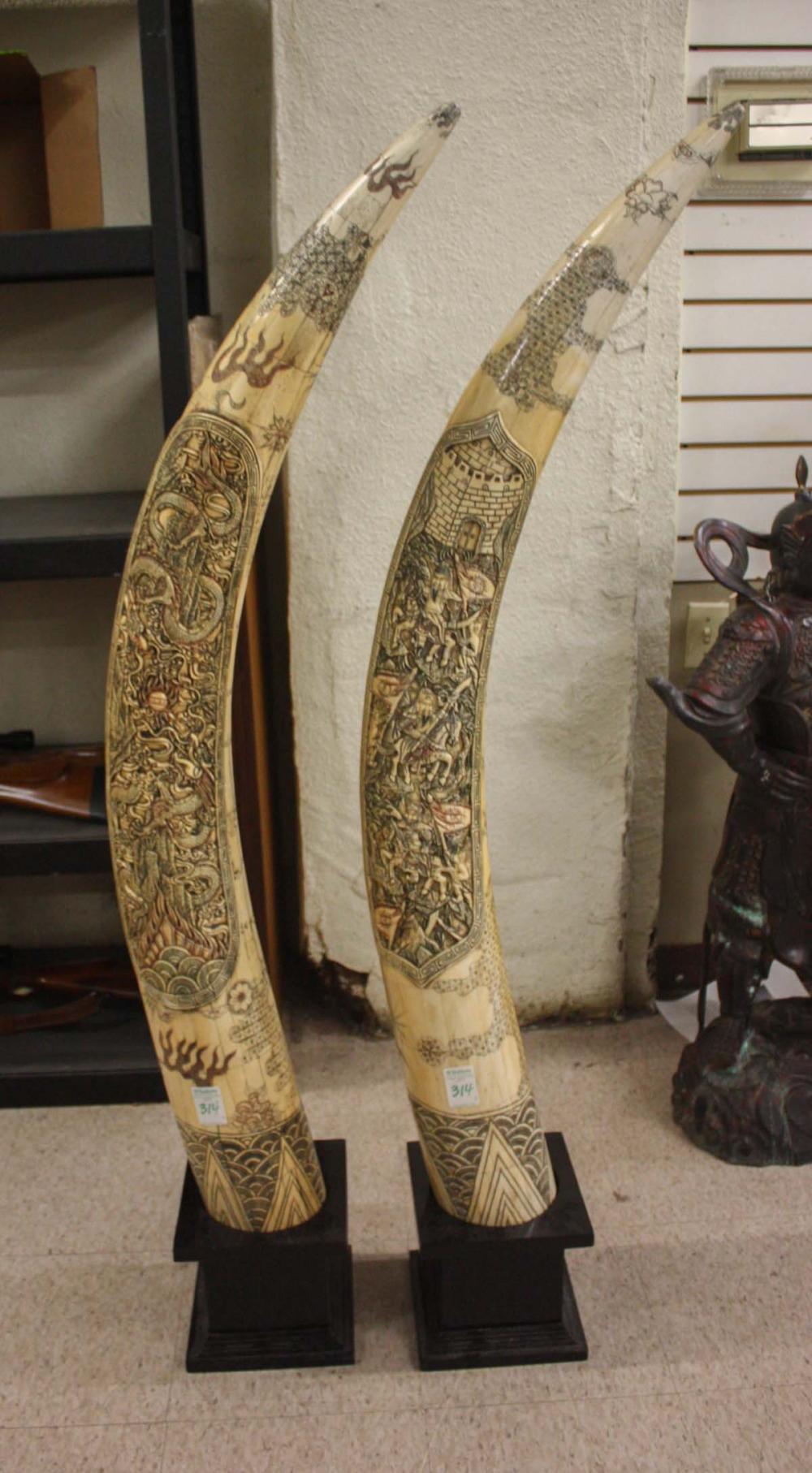 Appraisal: LARGE PAIR OF SCRIMSHAW DECORATED BONE TUSKS ON STANDS each