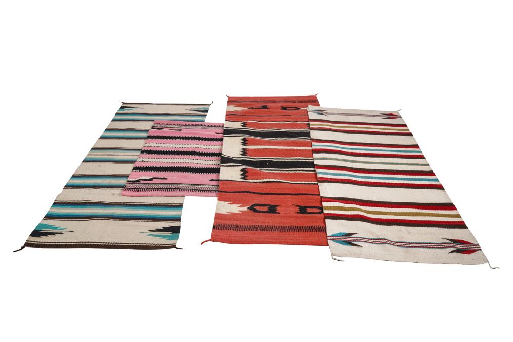 Appraisal: FOUR ASSORTED NAVAJO WOOL RUGSin various patterns and colors the