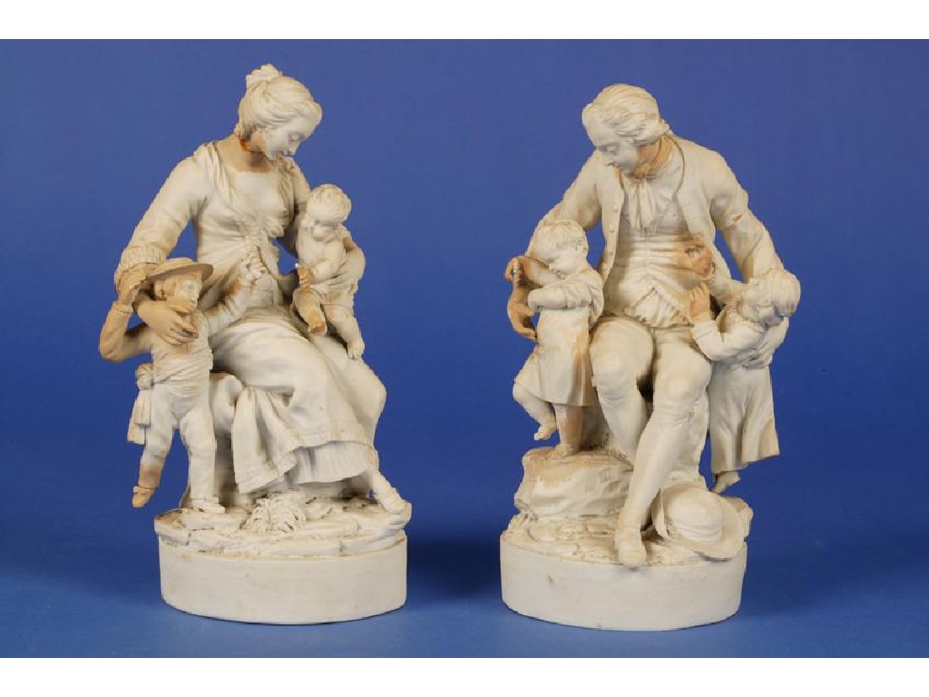 Appraisal: A PAIR OF WHITE BISCUIT PORCELAIN GROUPS of a man