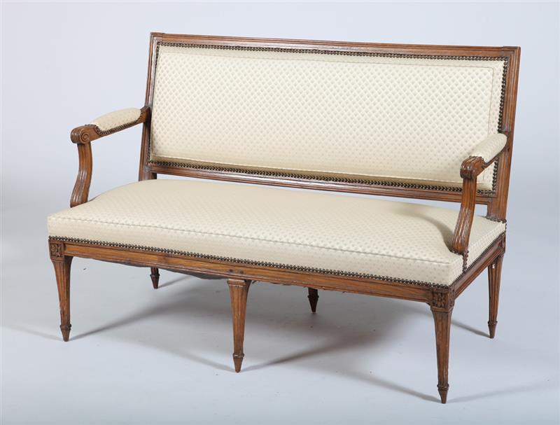 Appraisal: LOUIS XVI CARVED BEECHWOOD CANAP The rectangular upholstered backrest and