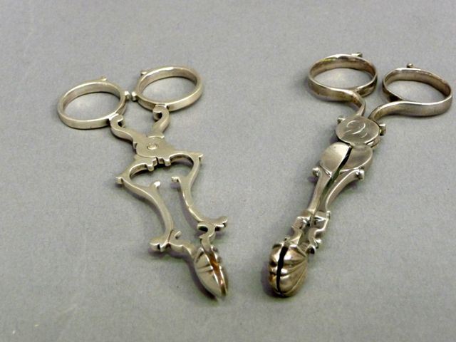 Appraisal: A pair of Sterling Silver sugar nips monnogrammed 'C' to