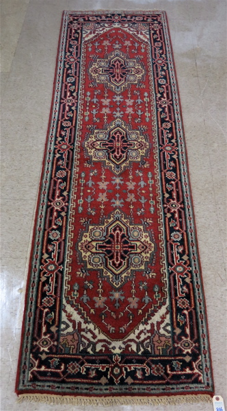 Appraisal: HAND KNOTTED ORIENTAL AREA RUG Persian Serapi design the lightly