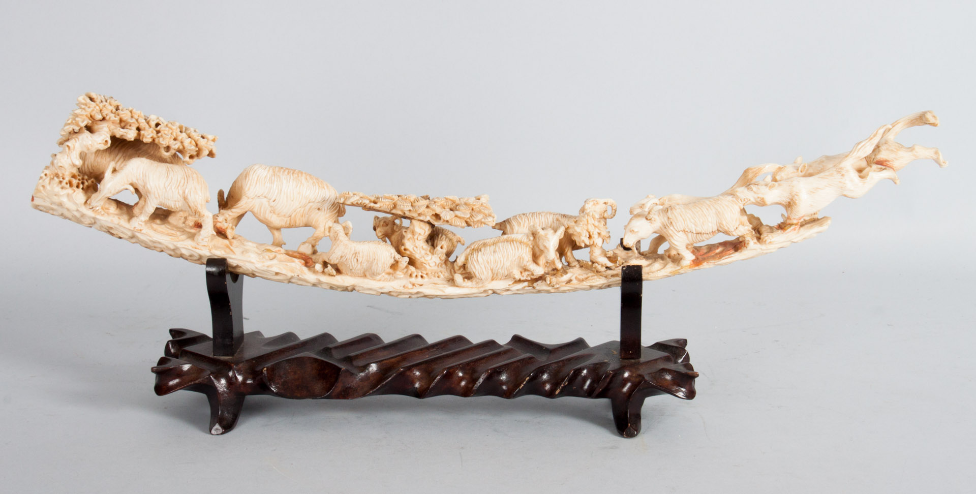 Appraisal: Chinese carved ivory wolf and sheep figural group modeled as