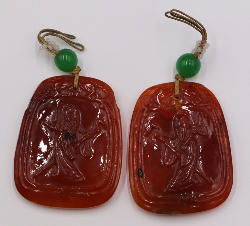 Appraisal: Chinese Carved Carnelian Pendants Includes Chinese carved Carnelian pendants displaying