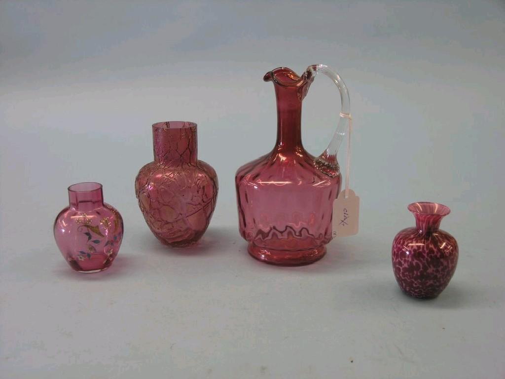 Appraisal: A Victorian cranberry glass jug in three other coloured glass