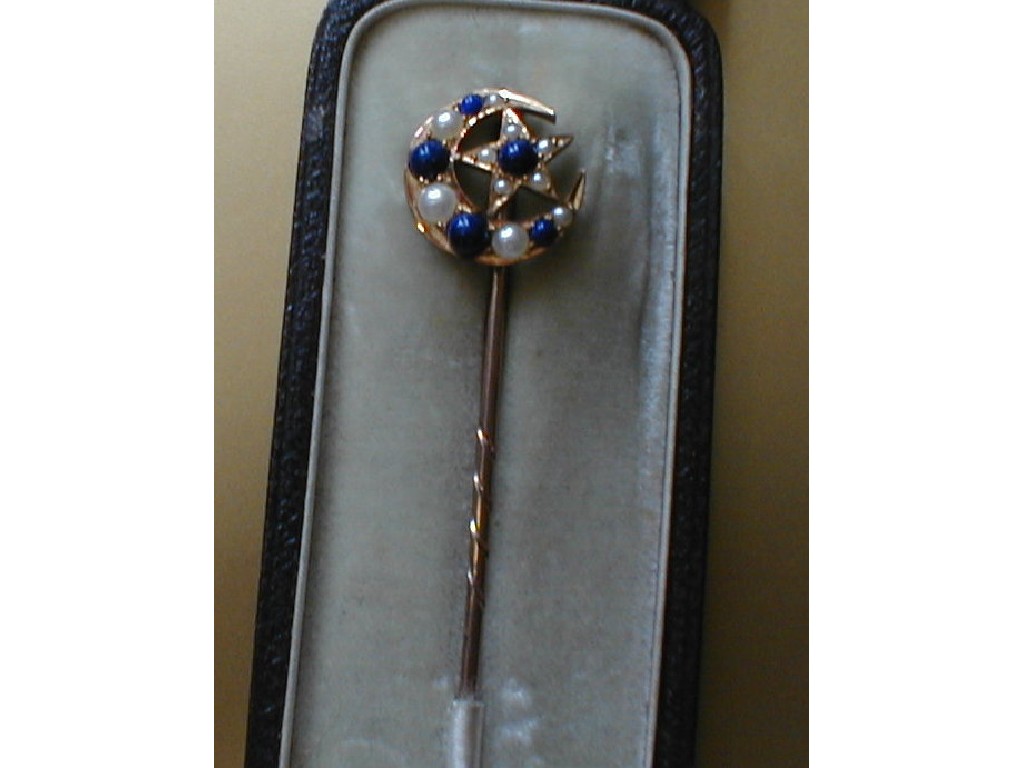 Appraisal: A stick pin topped with a crescent and star set