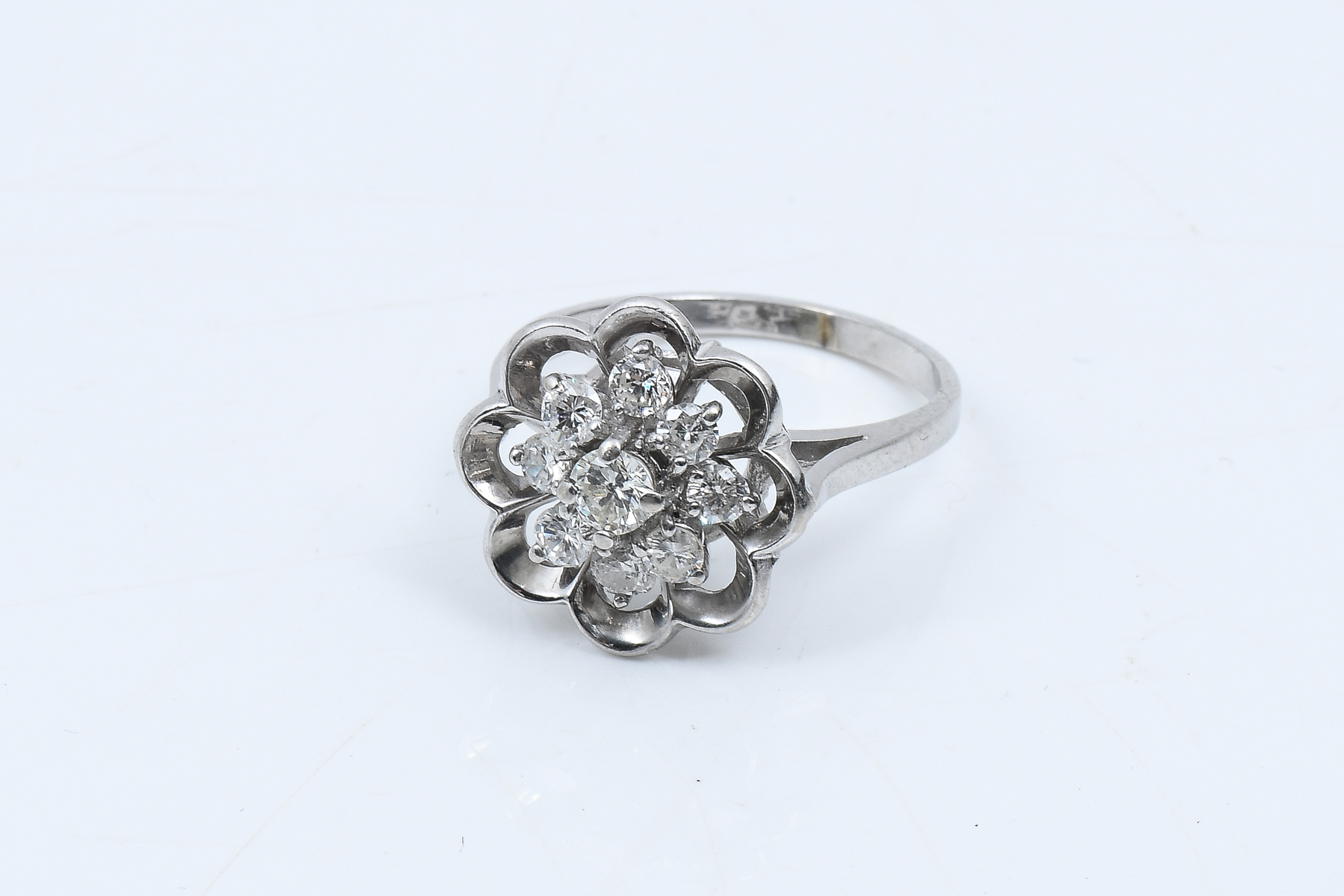 Appraisal: K DIAMOND FLOWER CLUSTER RING Quintessential diamond flower cluster ring