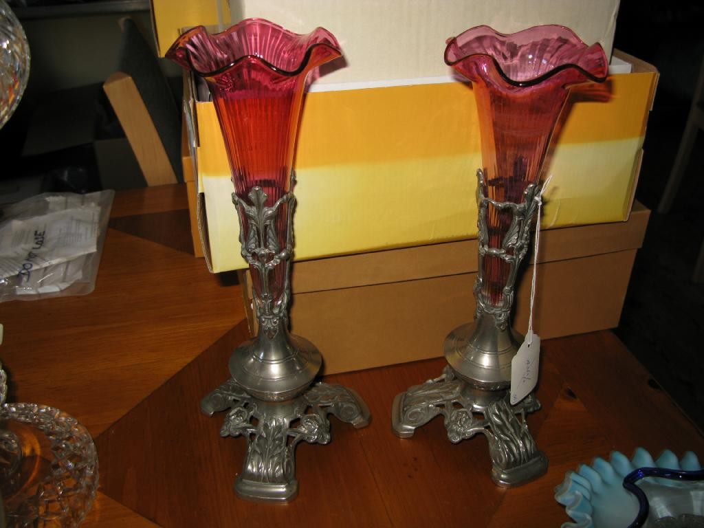 Appraisal: A pair of ruby glass posy vases on pewter stands