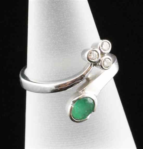 Appraisal: An ct white gold emerald and diamond cross-over ring Size