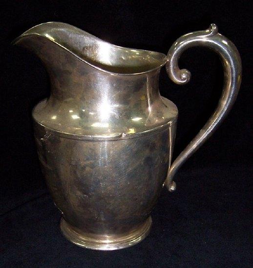 Appraisal: A pint jug with presentation inscription the base stamped Wallace