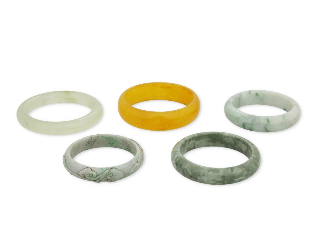 Appraisal: A GROUP OF FIVE JADE BANGLE BRACELETSA group of five