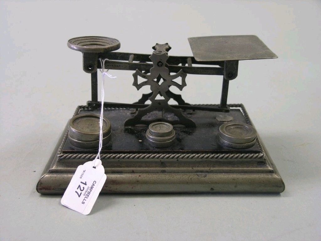 Appraisal: An S Mordan Co desk-top postal scale complete with four