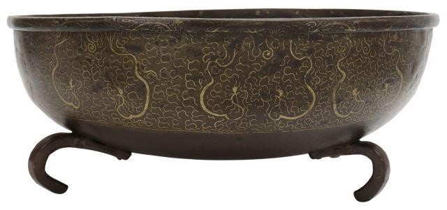 Appraisal: Large Chinese iron bowl decorative band with scroll design rising