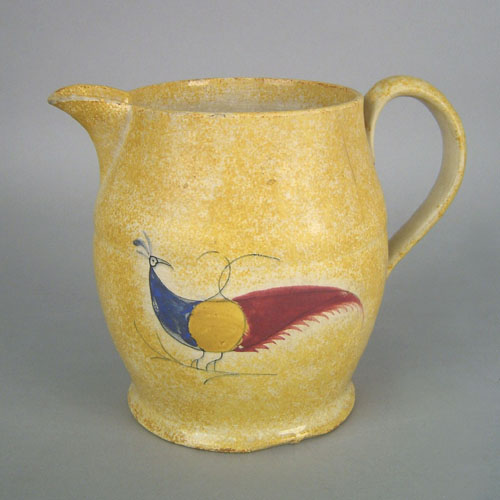 Appraisal: Yellow spatter pitcher th c with peafowl decoration h