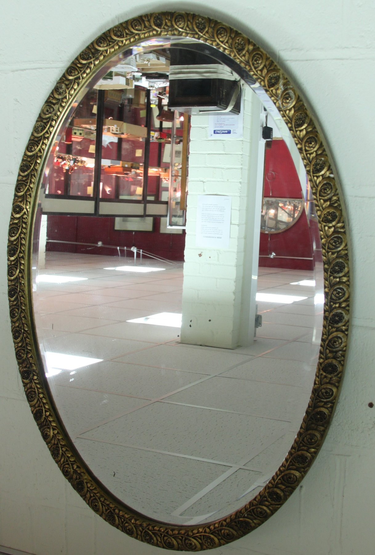 Appraisal: An oval gilt framed mirror the bevelled glass cm x