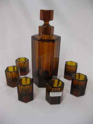 Appraisal: Moser Art Glass Decanter Cordial Set hexagon shape rich amber