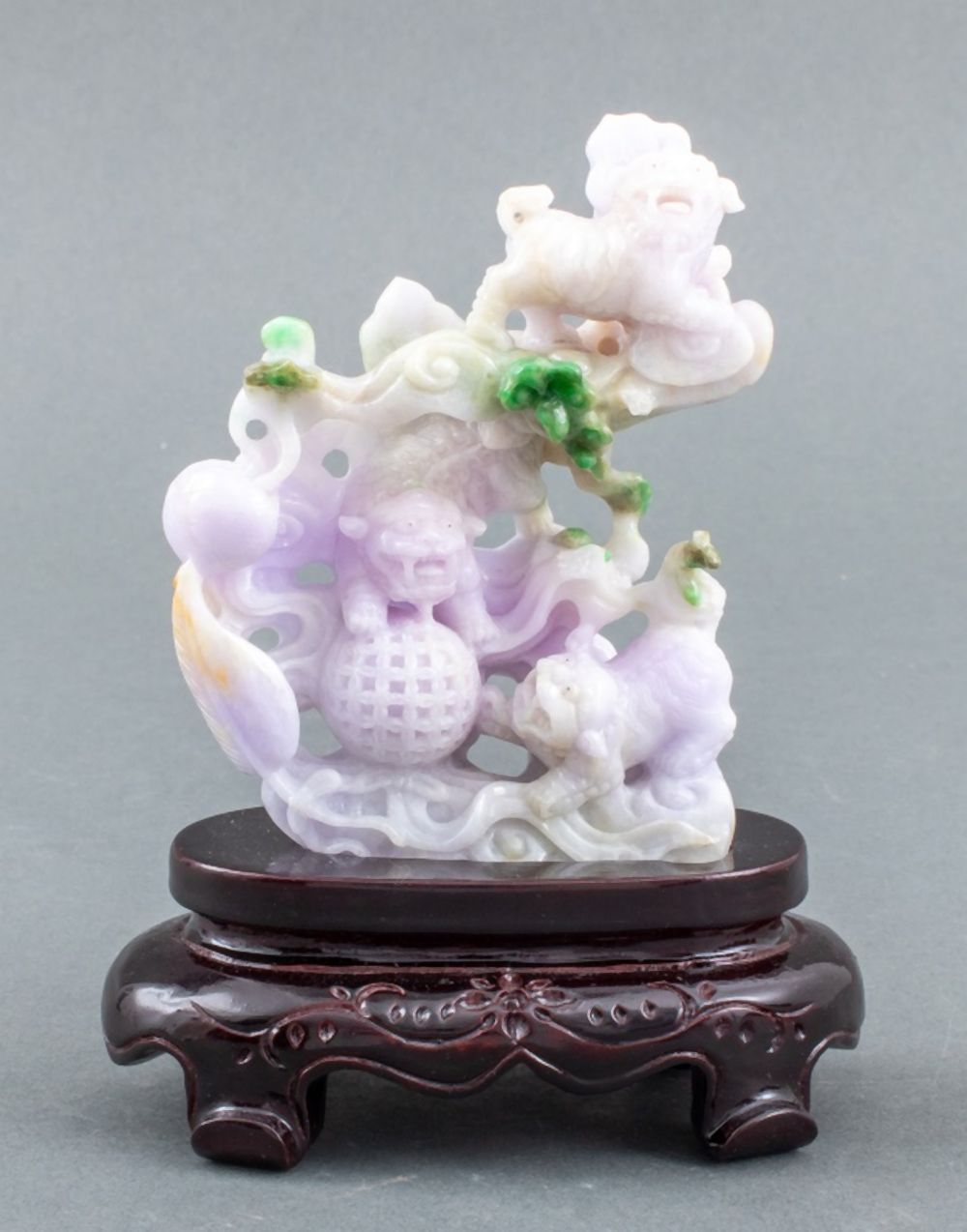 Appraisal: CHINESE EMERALD LAVENDER JADE FOO DOGS CARVING Chinese emerald green