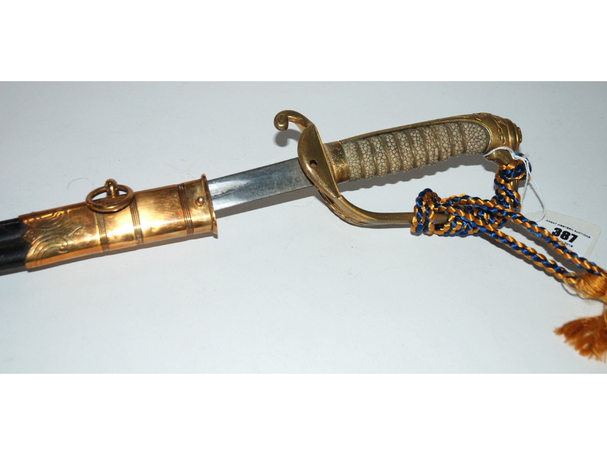 Appraisal: An officers dress sword with brass mounting and shagreen hilt