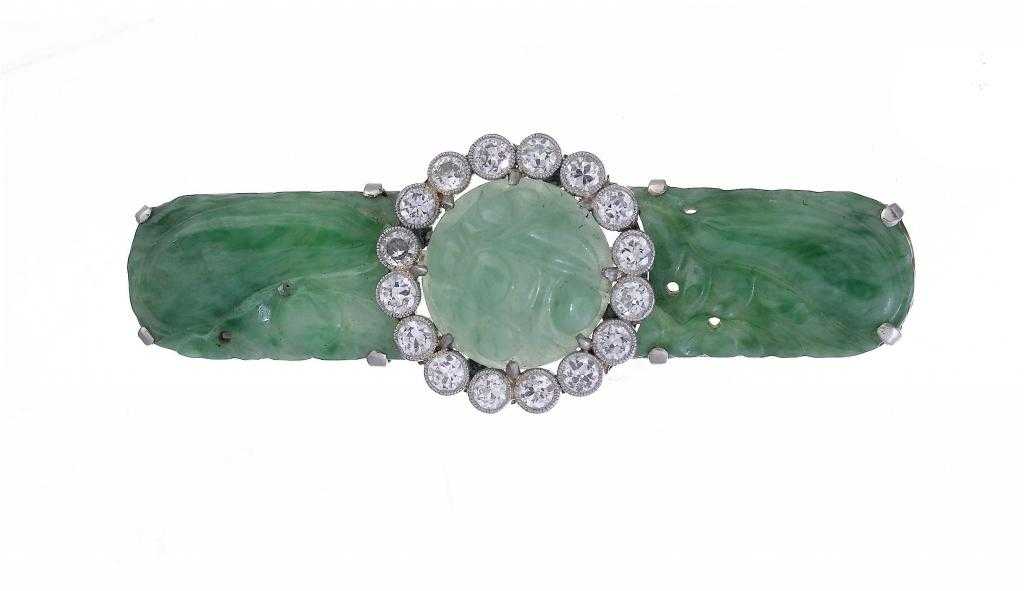 Appraisal: A DIAMOND AND JADEITE BROOCH the central carved cabochon in