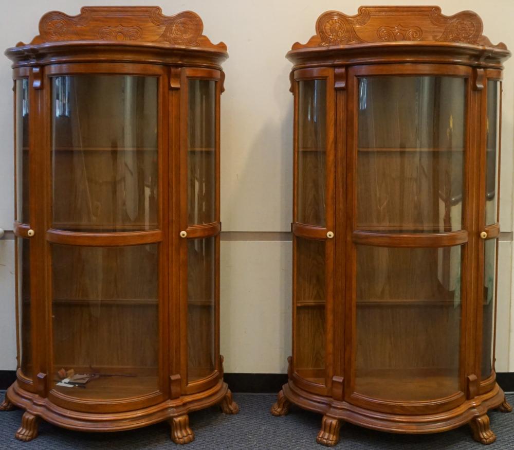 Appraisal: Pair Renaissance Style Oak Serpentine Glass Front China Cabinets HWD