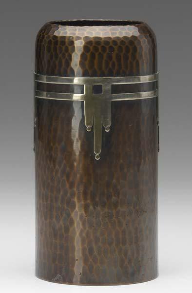 Appraisal: ROYCROFT Hammered copper cylindrical vase with silver overlay Exhibited in