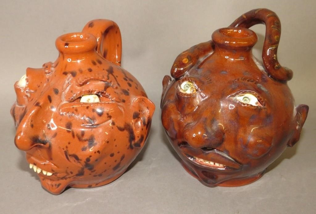 Appraisal: FOLK ART REDWARE FACE JUGS BY WES MUCKEY GREGca both