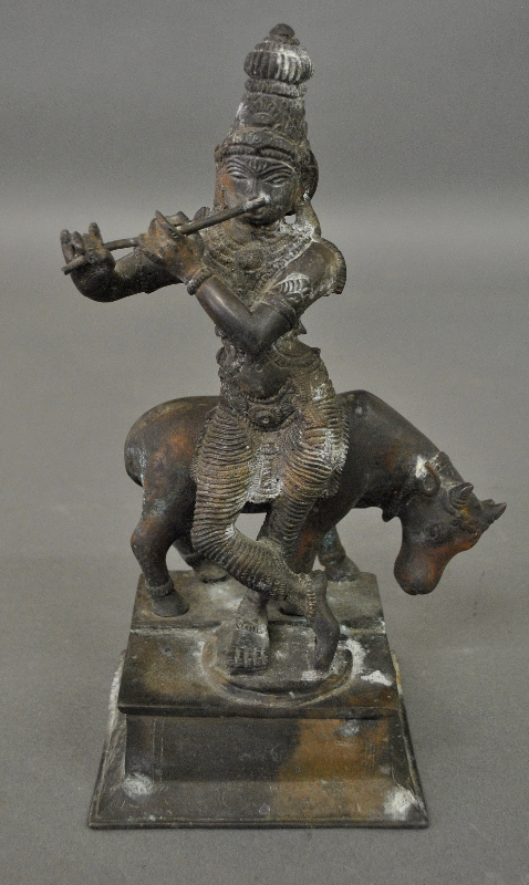 Appraisal: - Chinese bronze of a Tibetan figure with a cow