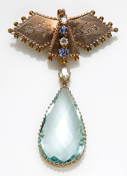 Appraisal: An aquamarine diamond sapphire k and k gold pendant-brooch with