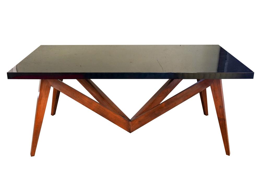 Appraisal: MODERNIST SPIDER DINING TABLElacquered goatskin and stained wood inches wide