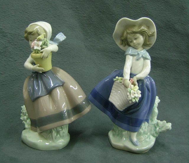 Appraisal: Lladro Porcelain Figurines two girls with flower bouquets