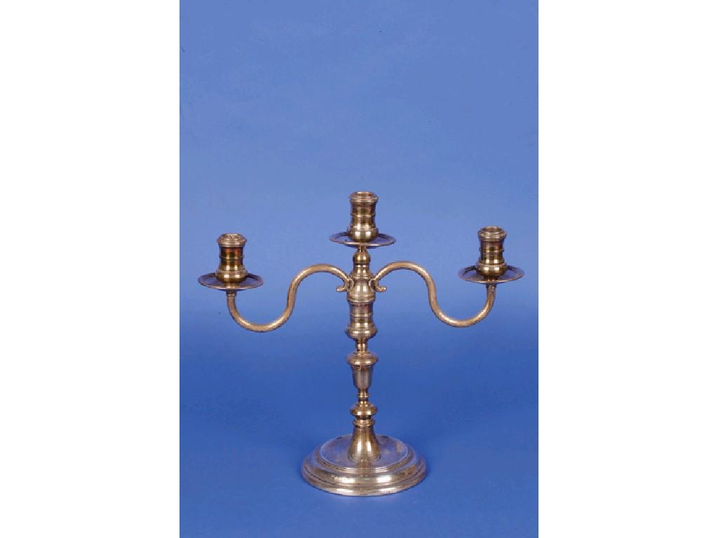 Appraisal: A THREE LIGHT CANDELABRUM the circular knopped stem on circular