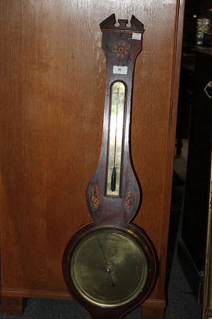 Appraisal: A GEORGIAN MAHOGANY WHEEL BAROMETER with thermometer brass dials inlaid