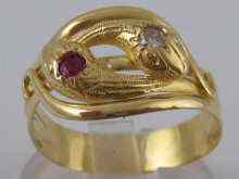 Appraisal: An carat gold French double headed diamond and ruby snake