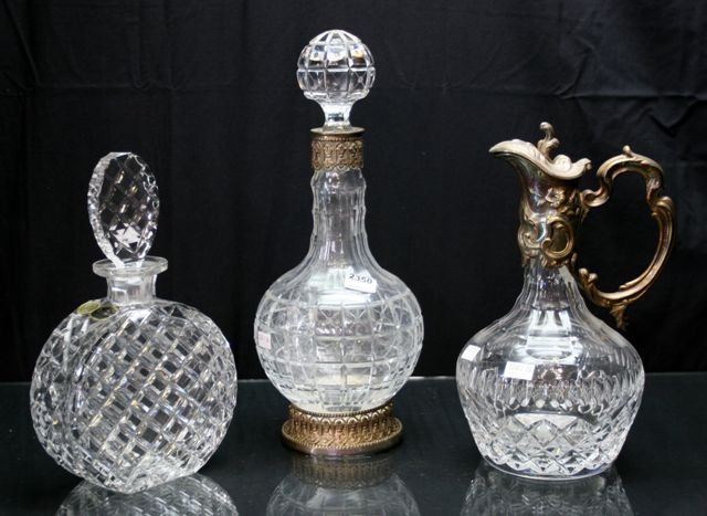 Appraisal: Two Bohemian crystal decanters together with a silverplate mounted cut