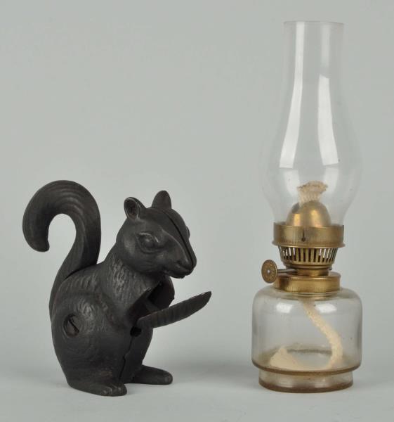 Appraisal: Lot Of Squirrel Nutcracker And An Oil Lamp This lot