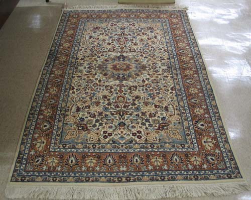 Appraisal: HAND KNOTTED ORIENTAL AREA RUG Pakistani-Persian floral and central floral