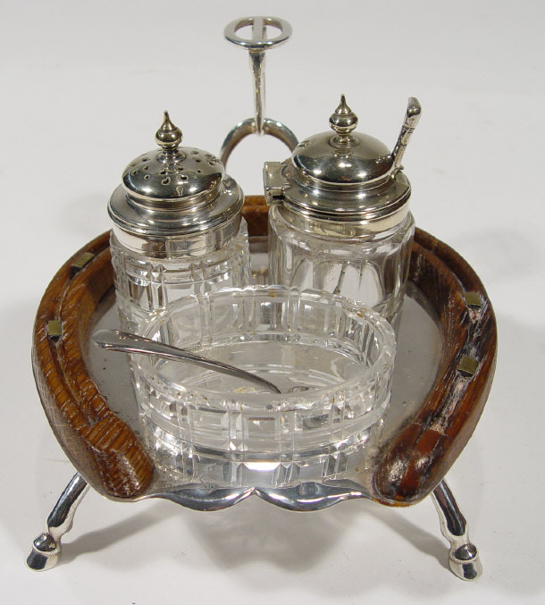 Appraisal: Silver plated horseshoe shaped novelty cruet set the oak and