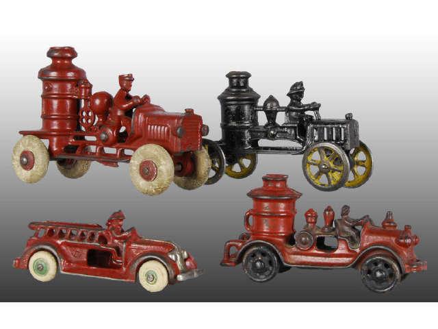 Appraisal: Lot of Cast Iron Fire Truck Toys Description Three fire