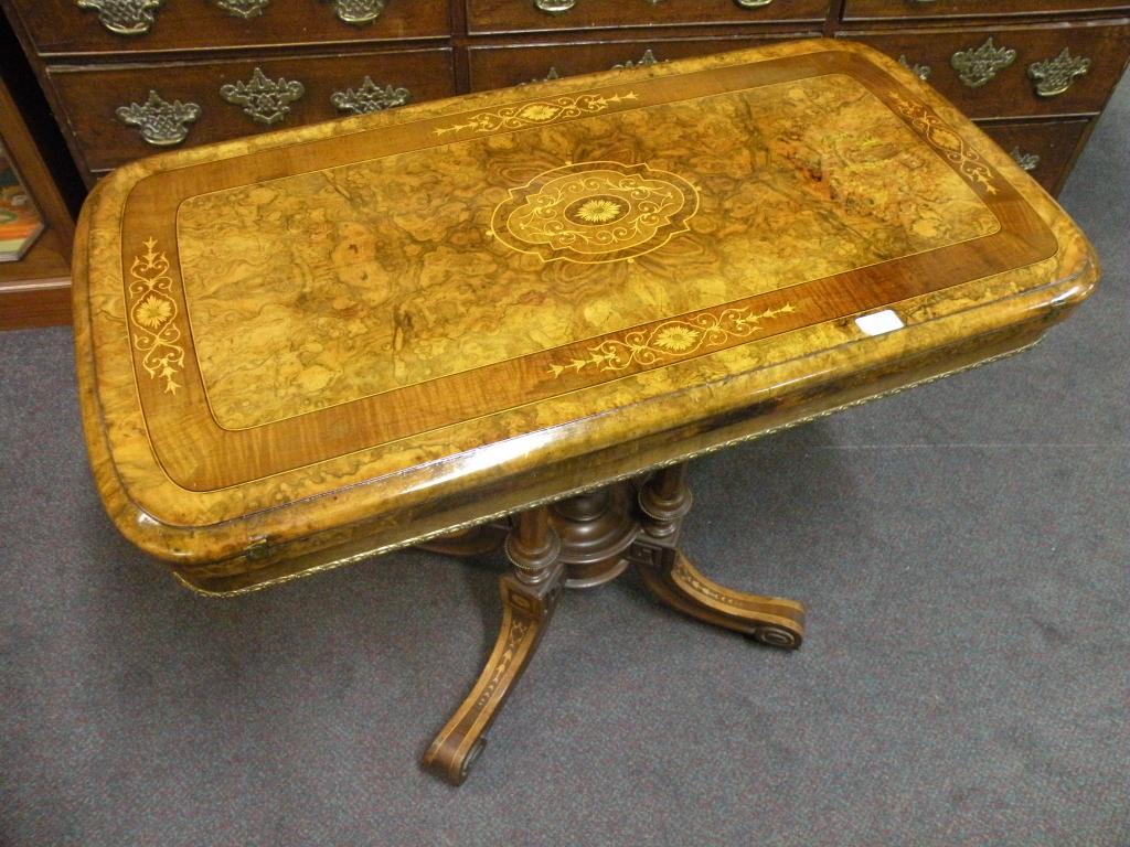 Appraisal: A Victorian walnut and marquetry card table with gilt metal