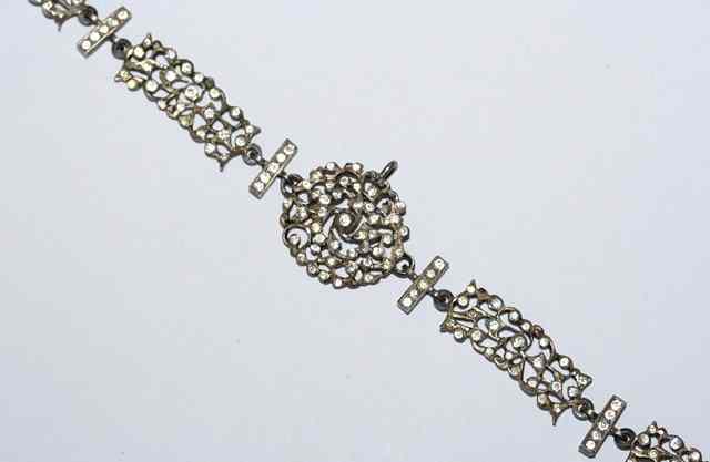 Appraisal: A SILVER AND PASTE SET PANEL NECKLACE of pierced leaf