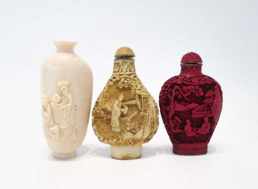 Appraisal: THREE CHINESE SNUFF BOTTLES cinnabar style flattened form with high