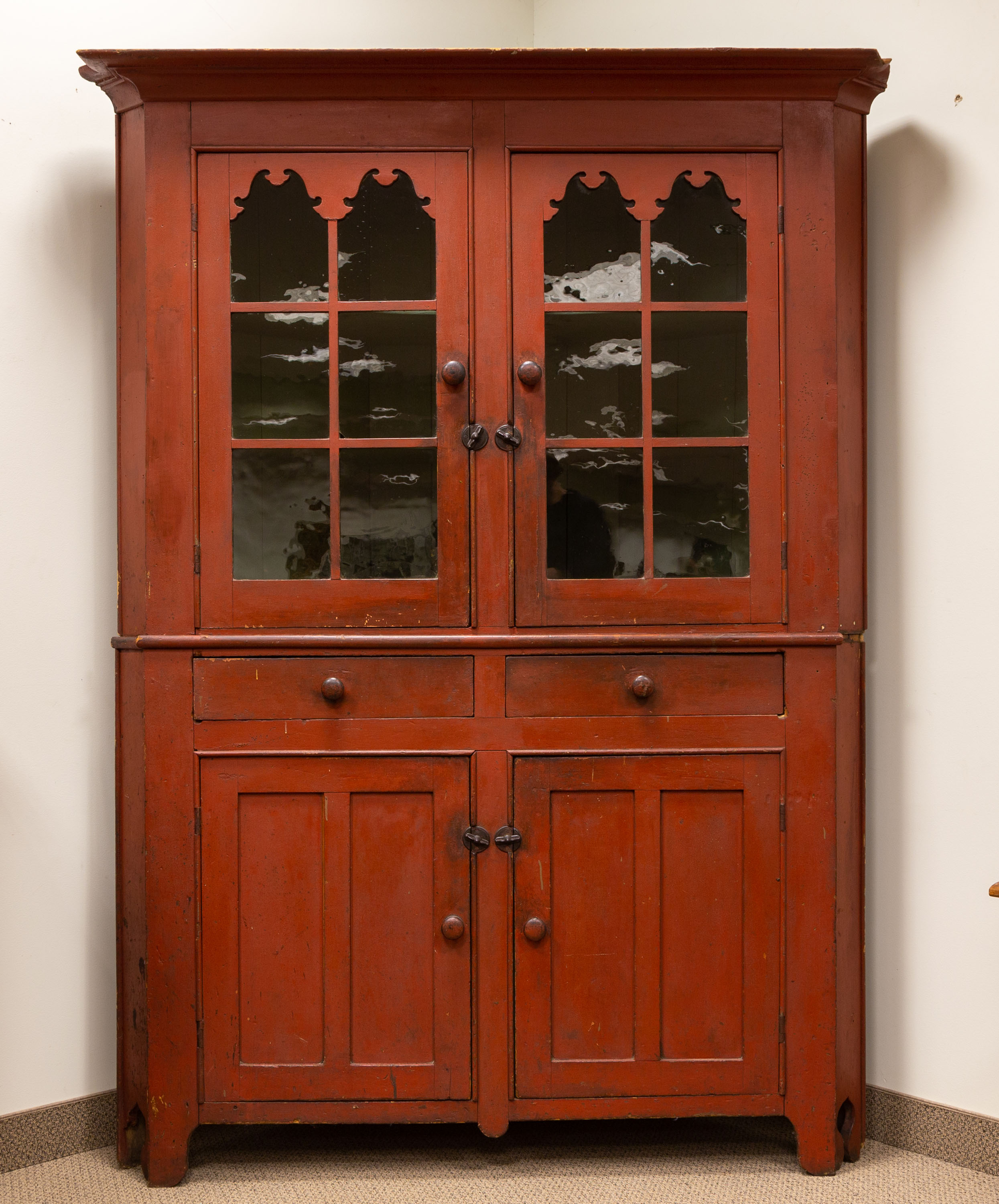 Appraisal: TH CENTURY RED PAINTED CORNER CABINET Original red paint and