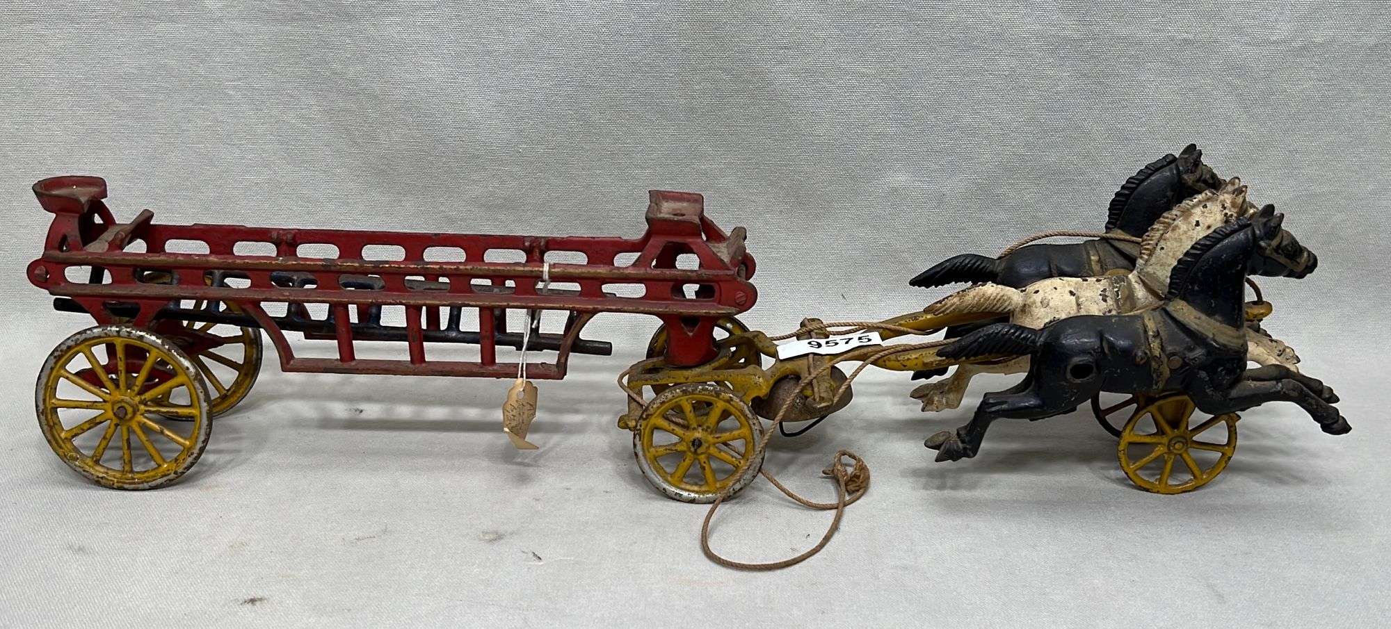 Appraisal: American cast iron horse-drawn fire ladder wagon toyearly th century