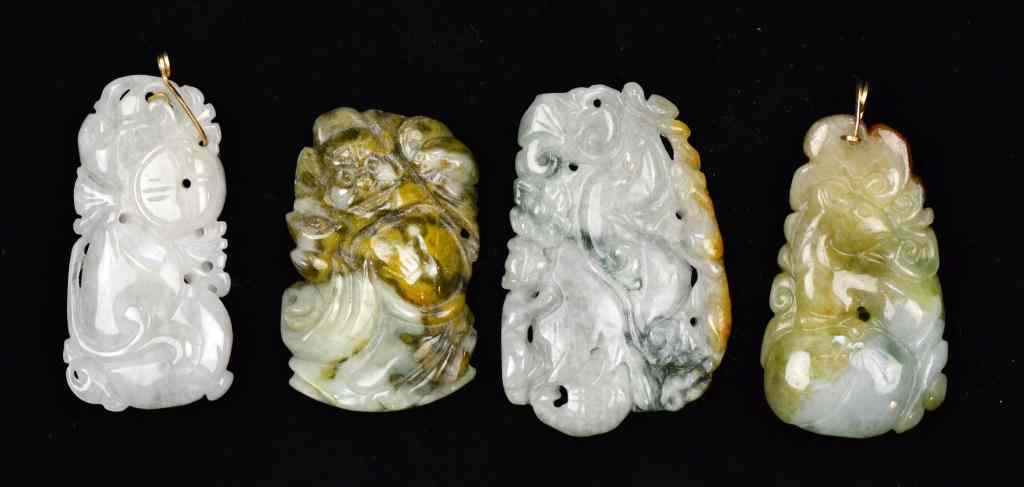 Appraisal: Chinese Qing Carved Jade PendantsFinely carved to depict fruit animals