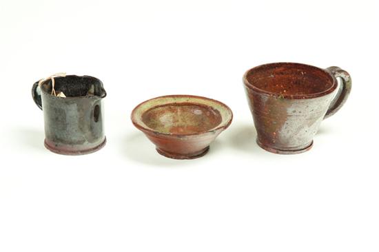 Appraisal: THREE PIECES OF REDWARE American th century Includes a miniature