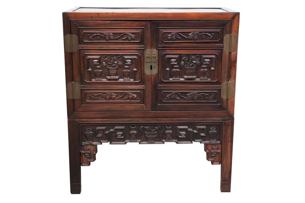 Appraisal: CHINESE CARVED HARDWOOD CABINET ON STANDthe two hinged doors concealing