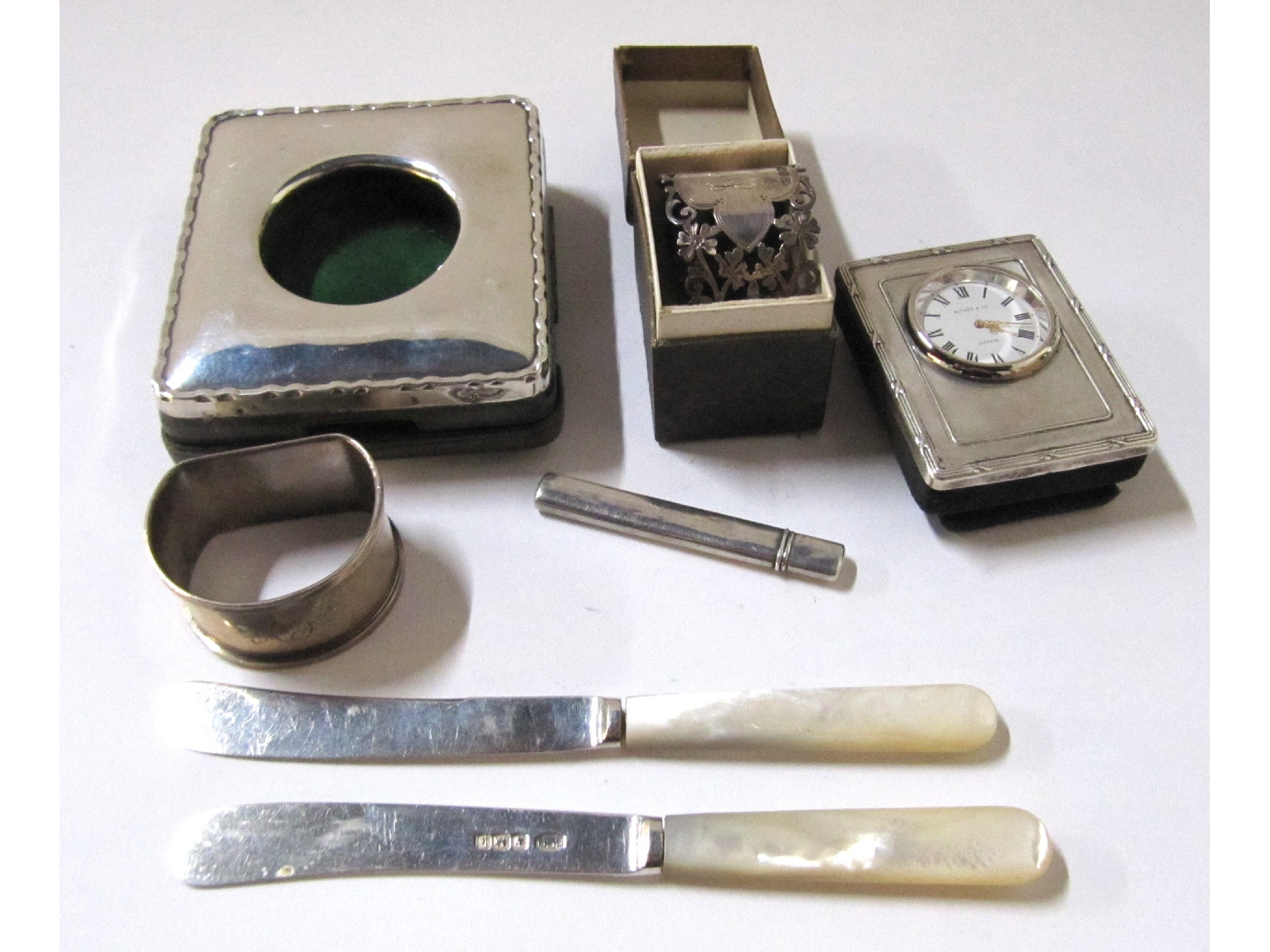 Appraisal: A lot comprising a silver watch case two silver napkin