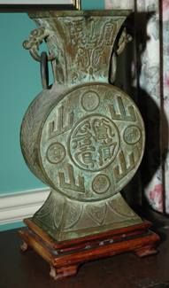 Appraisal: AN ARCHAIC STYLE BRONZE TWO HANDLED VASE ON STAND